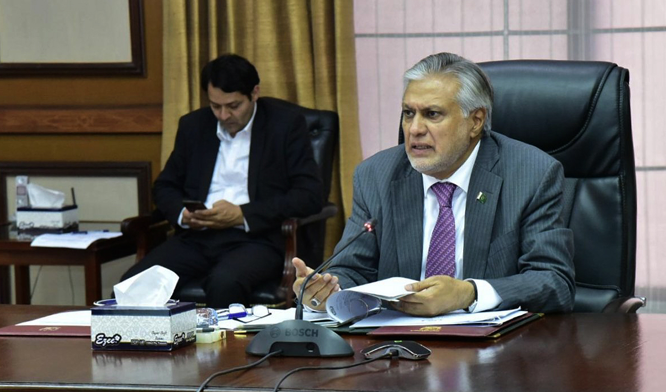 This handout picture, released by Finance Ministry on March 14, 2023, shows Pakistan's finance minister Ishaq Dar chairing the Economic Coordination Committee in Islamabad. (Photo courtesy: Twitter/FinMinistryPak)