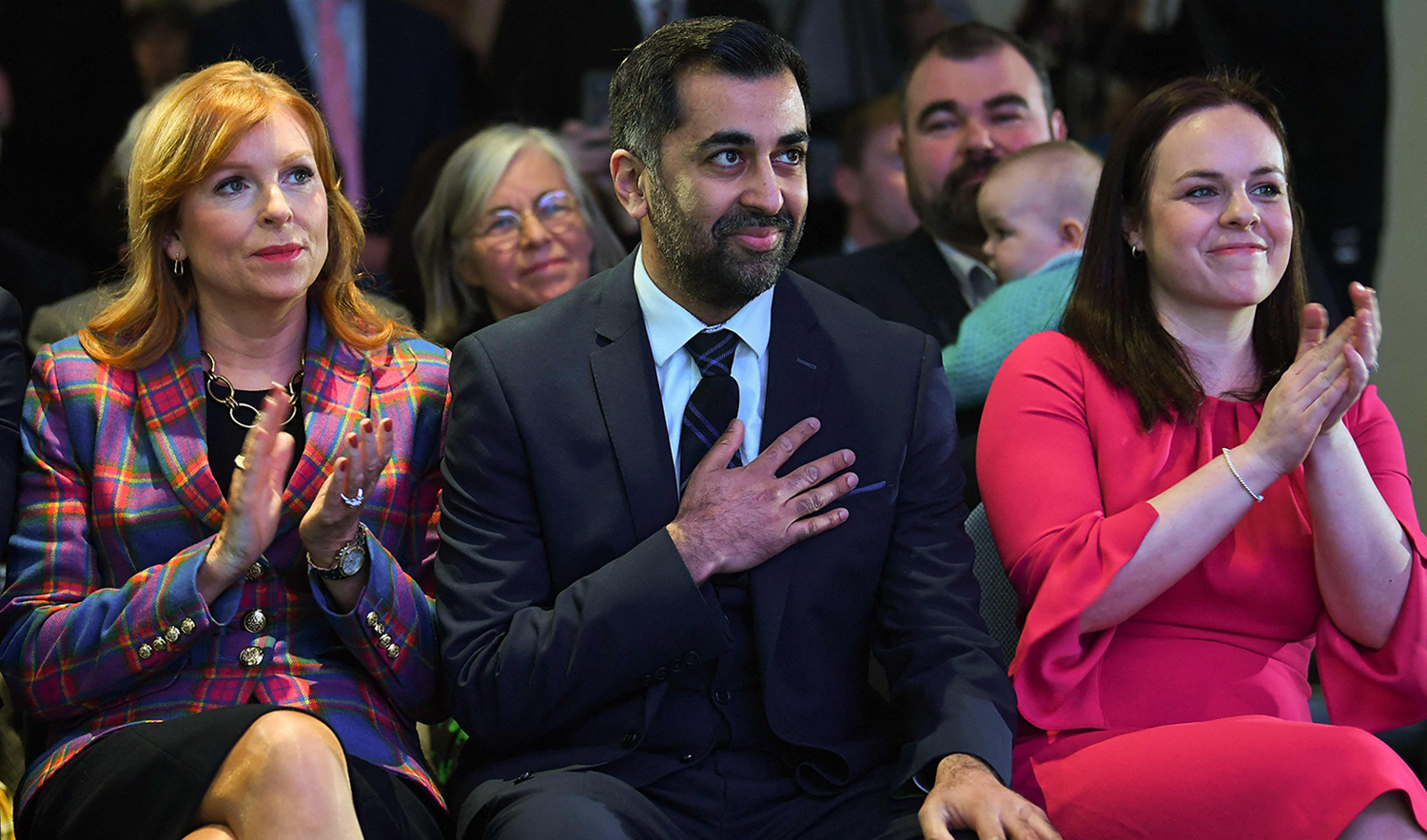 Scottish National Party (SNP) leader Humza Yousaf, center, reacts as he hears he has won the the SNP Leadership election vote, during the result announcement at Murrayfield Stadium in Edinburgh on March 27, 2023. (AFP)