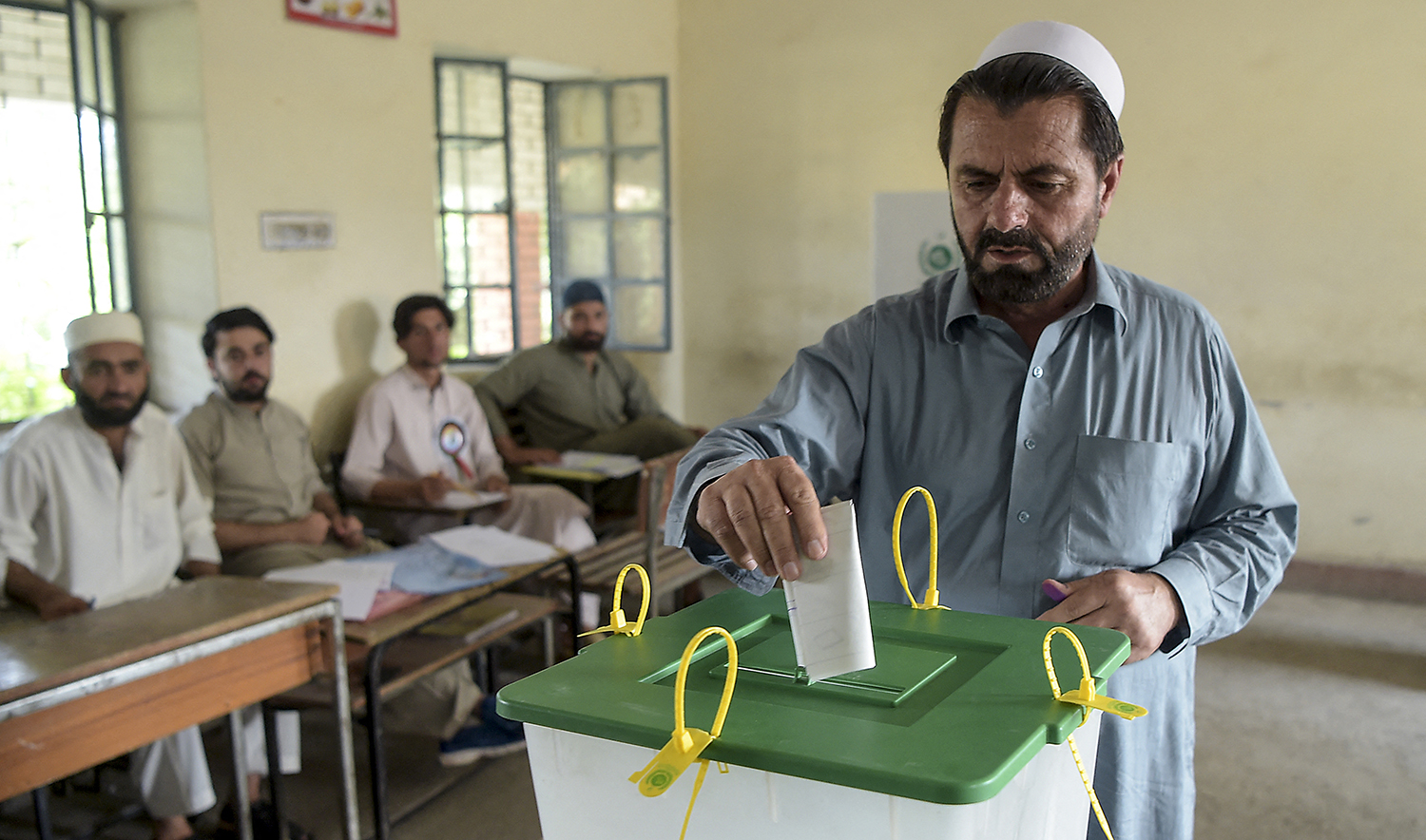 A tribesman ballot casts his vote in a polling station for the first provincial elections in Jamrud, a town of Pakistan's Khyber Pakhtunkhwa province on July 20, 2019. (AFP/File)