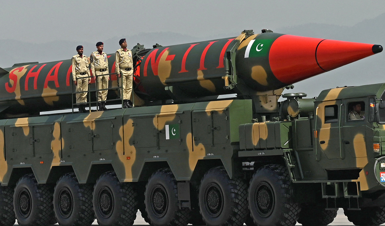 Pakistani military helicopters fly past a vehicle carrying a long-range ballistic Shaheen III missile during the military parade to mark Pakistan's National Day in Islamabad on March 25, 2021. (AFP/File)
