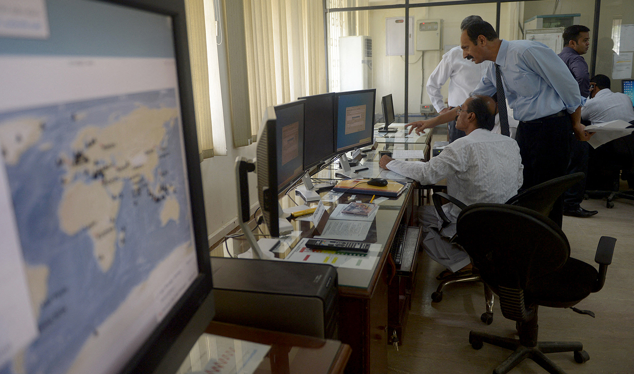 This file photo, taken on September 10, 2014, shows a Pakistani team member working at Met Office in Karachi. (Photo courtesy: AFP/File)