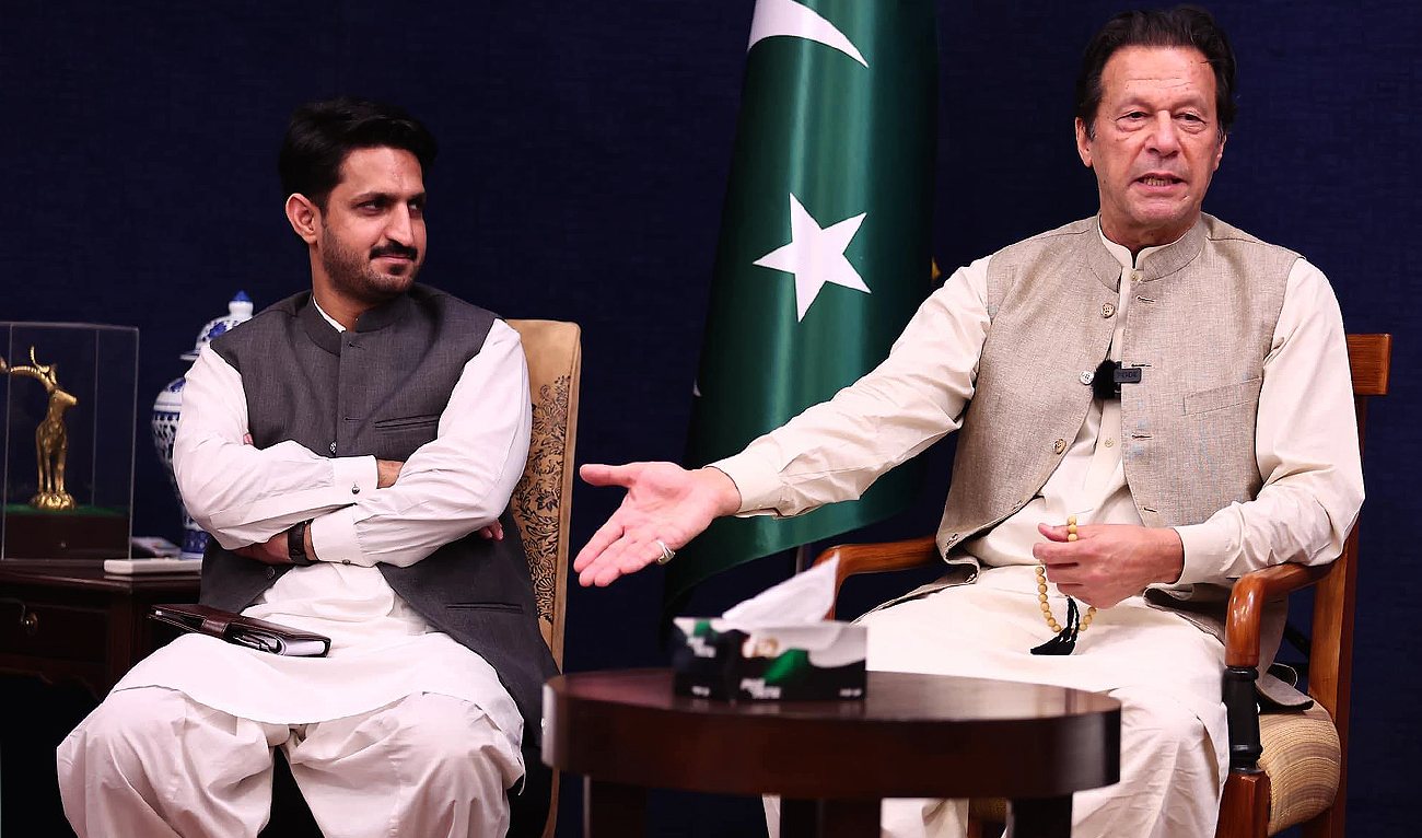 In this photo, posted on July 4, 2022, Pakistan's former prime minister Imran Khan (right) gestures before a press conference Pakistan Tehreek-e-Insaf party's social media advisor Azhar Mashwani (left) at his personal residence in Lahore. (Photo courtesy: Facebook/AzharQaziMashwani)