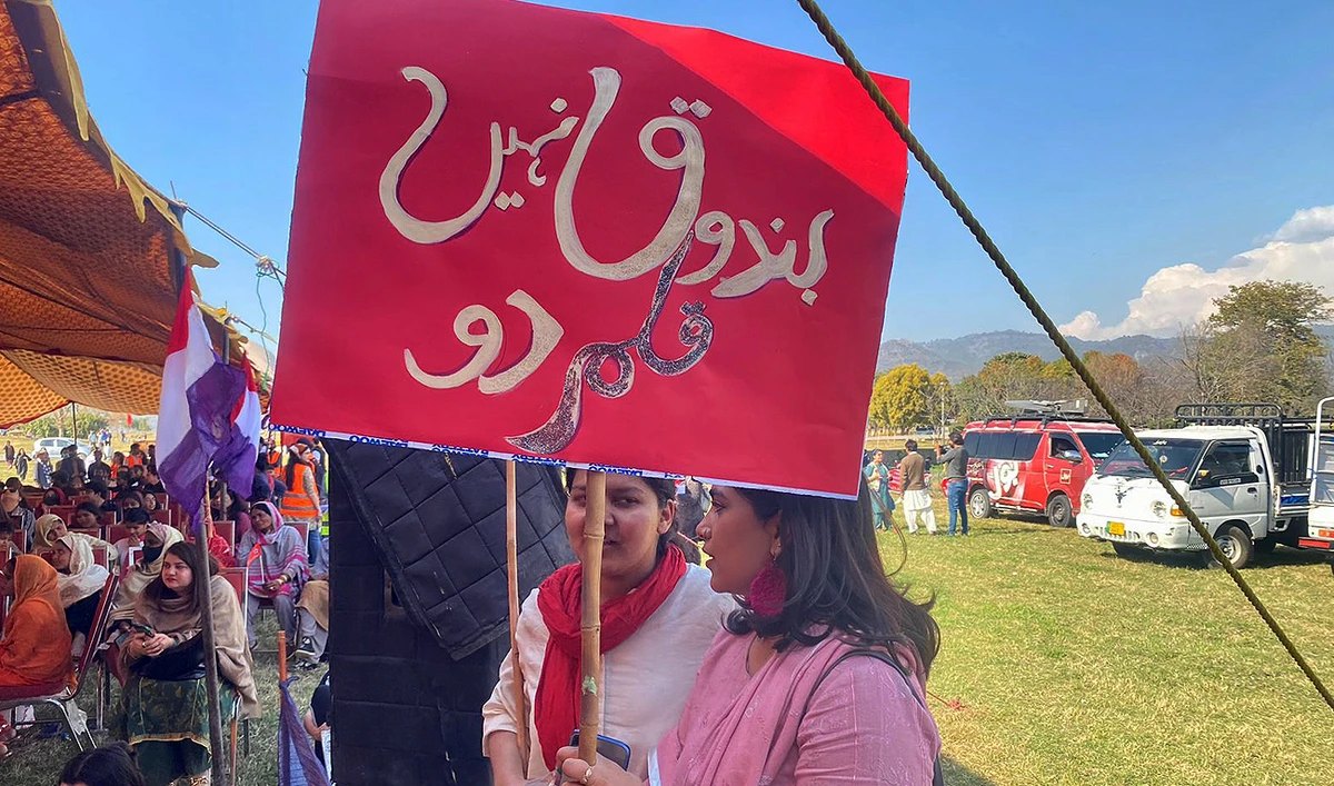 Activists of "Aurat Azadi March" carry placards during a gathering in Islamabad, Pakistan, on March 5, 2023. (AN Photo)
