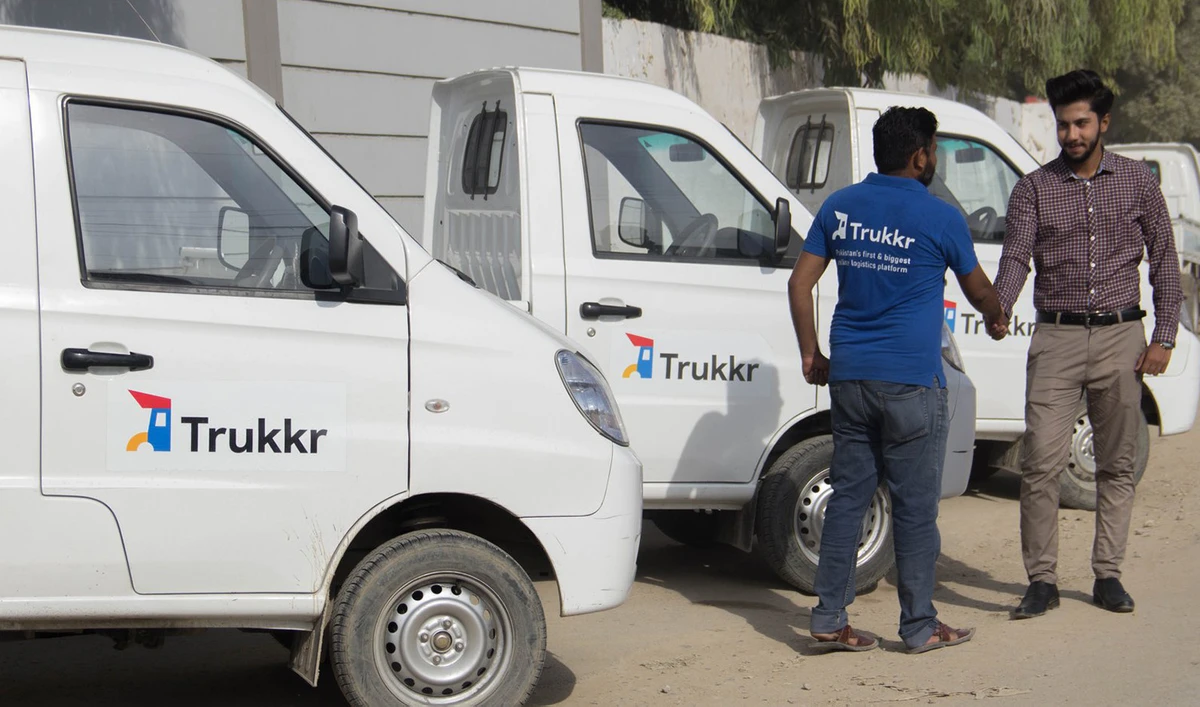 This undated file photo shows a Trukkr employee in Pakistan greeting a customer. (Photo courtes: @Trukkr/Facebook)