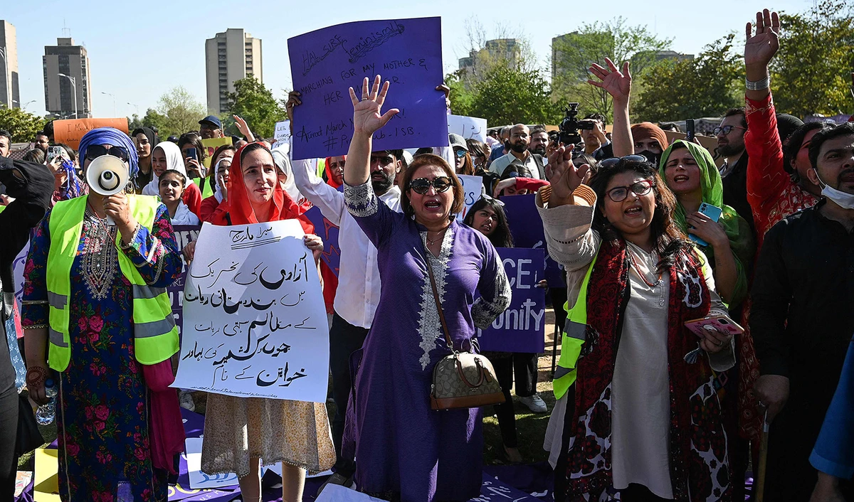 Activists of Aurat (women) March hold placards as chant slogans during a demonstration rally to mark the International Women's Day in Islamabad on March 8, 2023. (AFP)