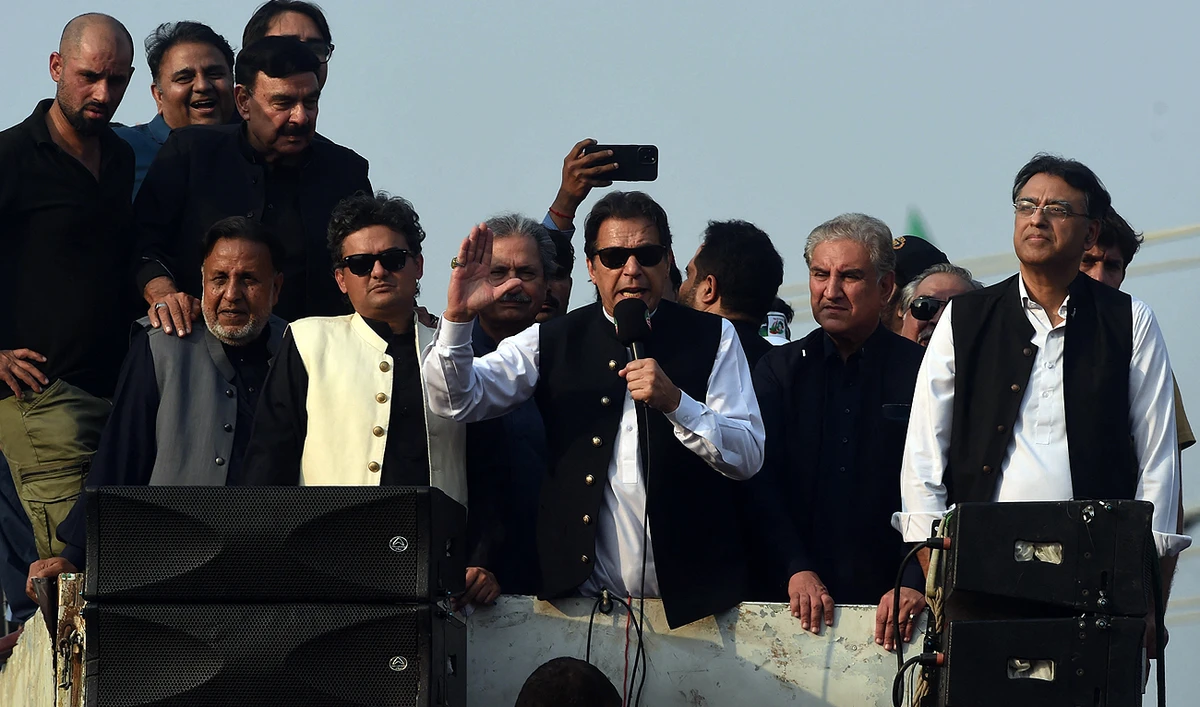 In this file photo, taken on October 28, 2022, former Pakistan prime minister Imran Khan (C) addresses his supporters during an anti-government long march in Lahore. (Photo courtesy: AFP/File)