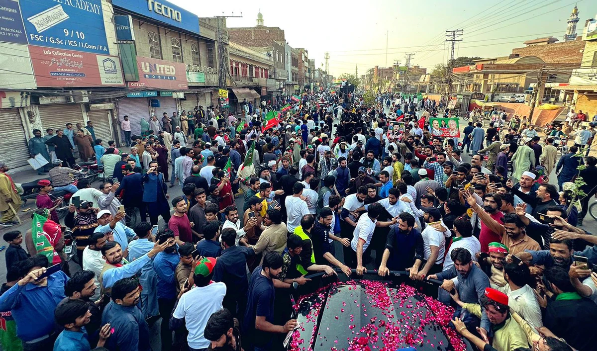 Supporters of former Pakistan Prime Minister Imran Khan's Tehreek-e-Insaf (PTI) party take part in a political rally in Lahore, Pakistan, on March 13, 2023. (Photo courtesy: @PTIOfficial/Twitter)