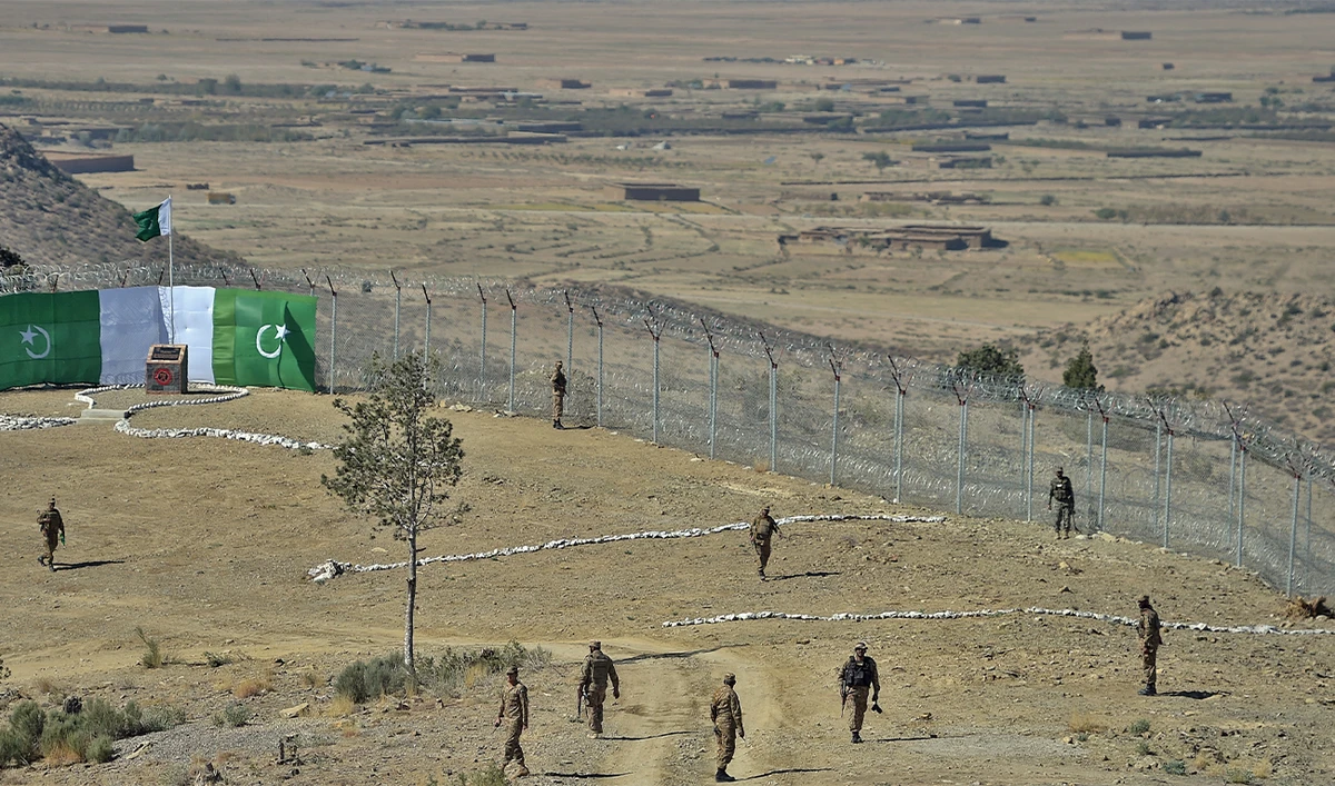 Pakistani soldiers patrol next to a newly fenced border fencing along with Afghan's Paktika province border in Angoor Adda in Pakistan's South Waziristan tribal agency on October 18, 2017. (AFP/File)