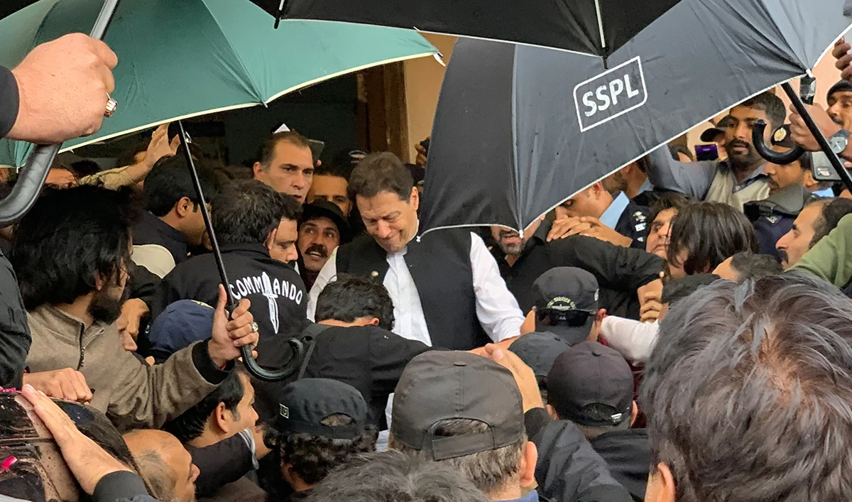 Pakistan's former Prime Minister Imran Khan (C) leaves after appearing at the court in Islamabad on February 28, 2023.