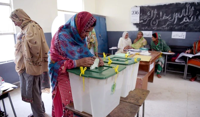 A woman casts her vote during Pakistan's general election at a polling station in Islamabad on July 25, 2018. (AFP/file)