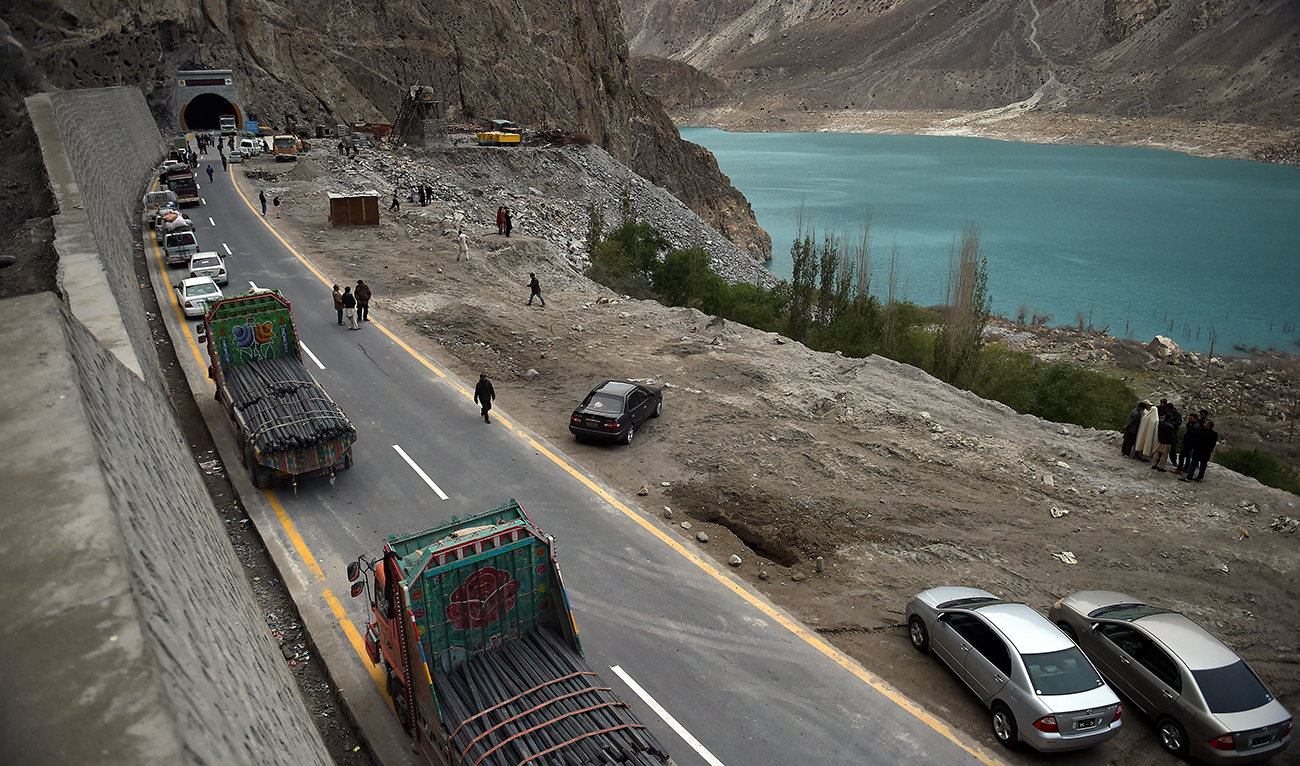 In this photograph taken on September 29, 2015, Pakistani commuters wait to travel through a newly built tunnel in northern Pakistan's Gojal Valley. (AFP/File)