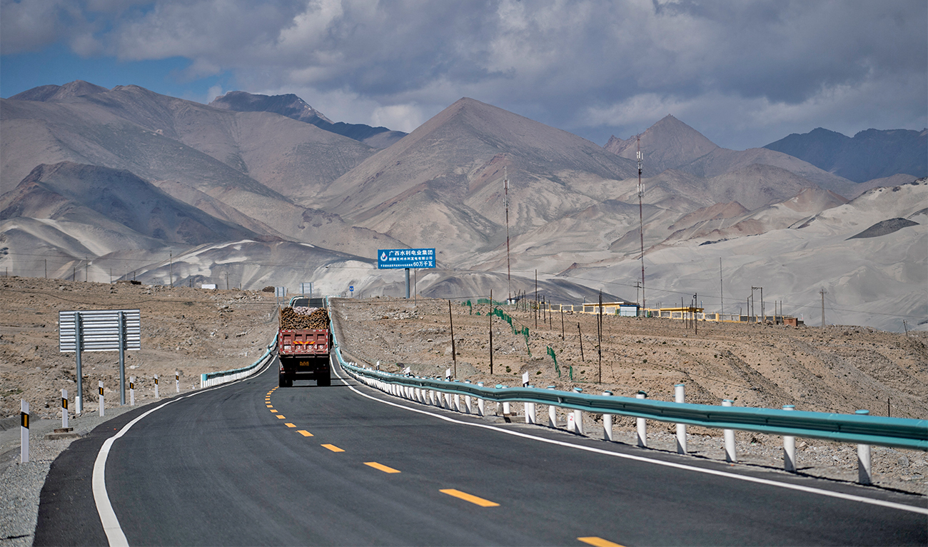 This picture taken on June 27, 2017 shows a truck driving along the China-Pakistan Friendship Highway before the Karakorum mountain range near Tashkurgan in China's western Xinjiang province. (AFP/File)