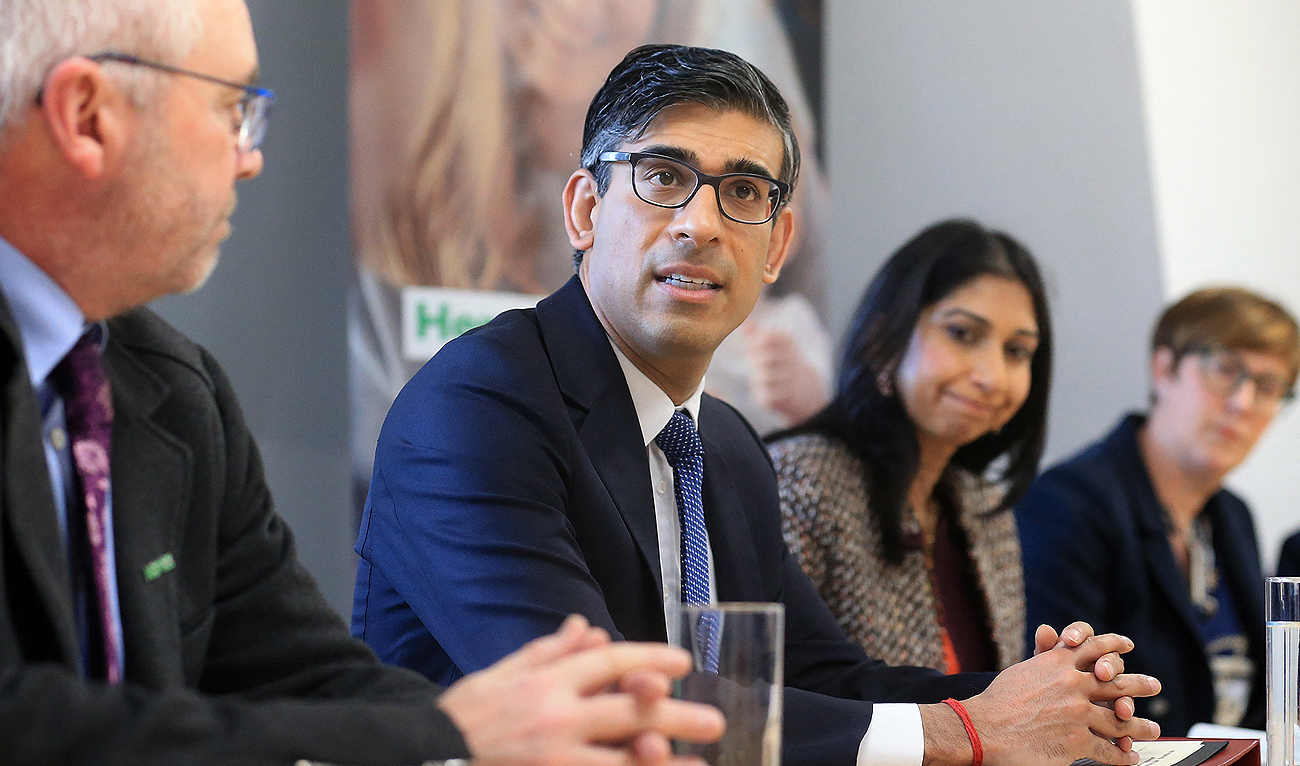 Britain's Prime Minister Rishi Sunak (2L), and Britain's Home Secretary Suella Braverman (2R) sit with National Society for the Prevention of Cruelty to Children (NSPCC) CEO Peter Wanless (L) take part in a meeting of the Grooming Gang Taskforce, during a visit to the offices of the NSPCC in Leeds, northern England, on April 3, 2023. (Photo courtesy: AFP)