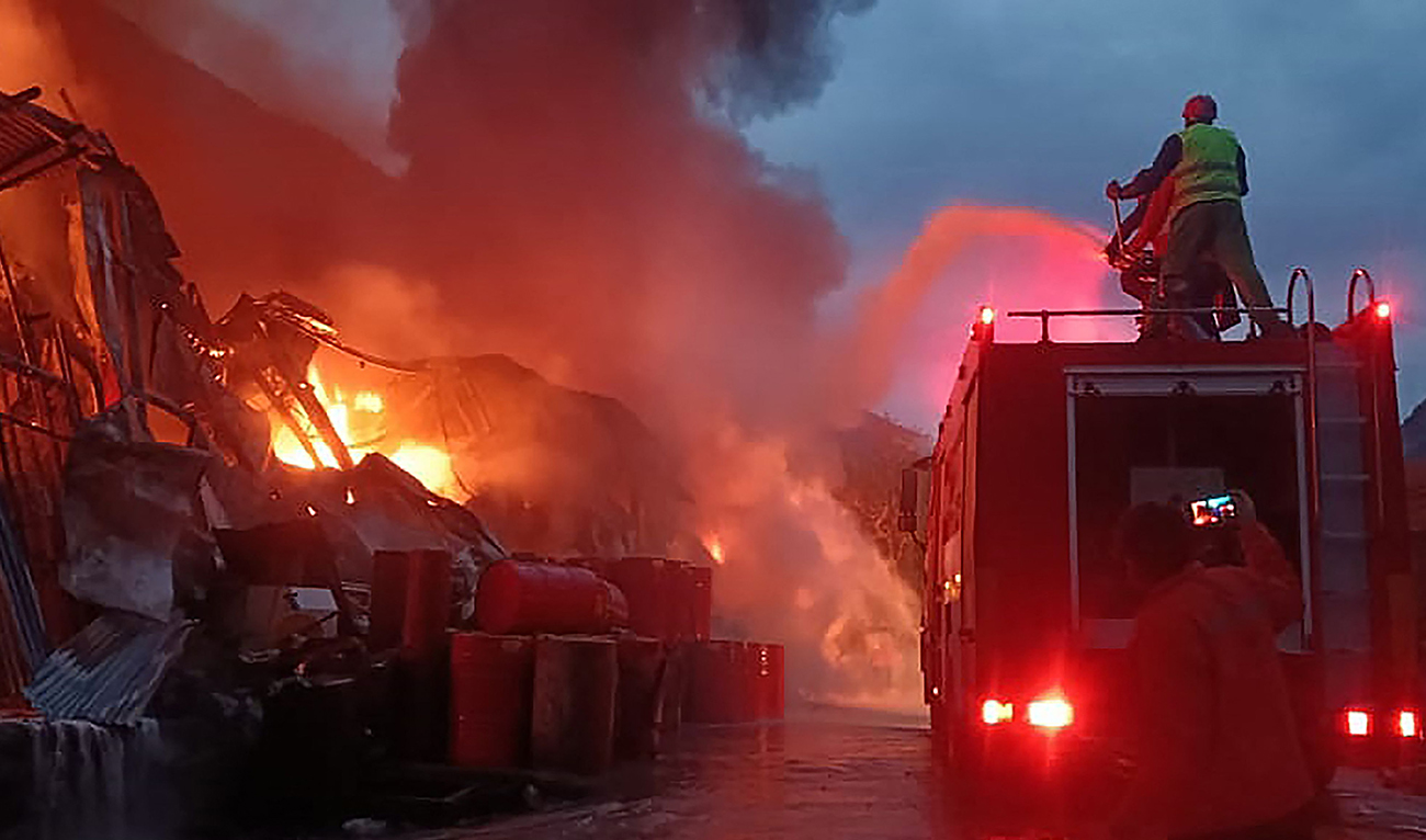 Emergency Rescue 1122 Service on April 4, 2023 shows firefighters trying to extinguish a fire that erupted at a warehouse of a hydropower dam construction site in Dasu, the main town in Upper Kohistan district of Pakistan's Khyber Pakhtunkhwa province. (Photo courtesy: AFP)