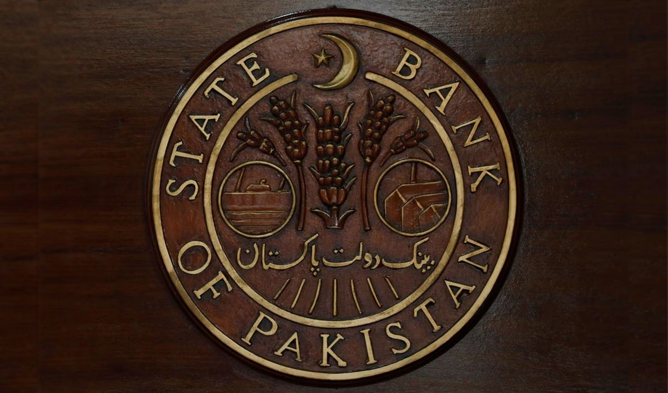 A logo of the State Bank of Pakistan (SBP) is pictured on a reception desk at the head office in Karachi, Pakistan on July 16, 2019. (REUTERS/File Photo)