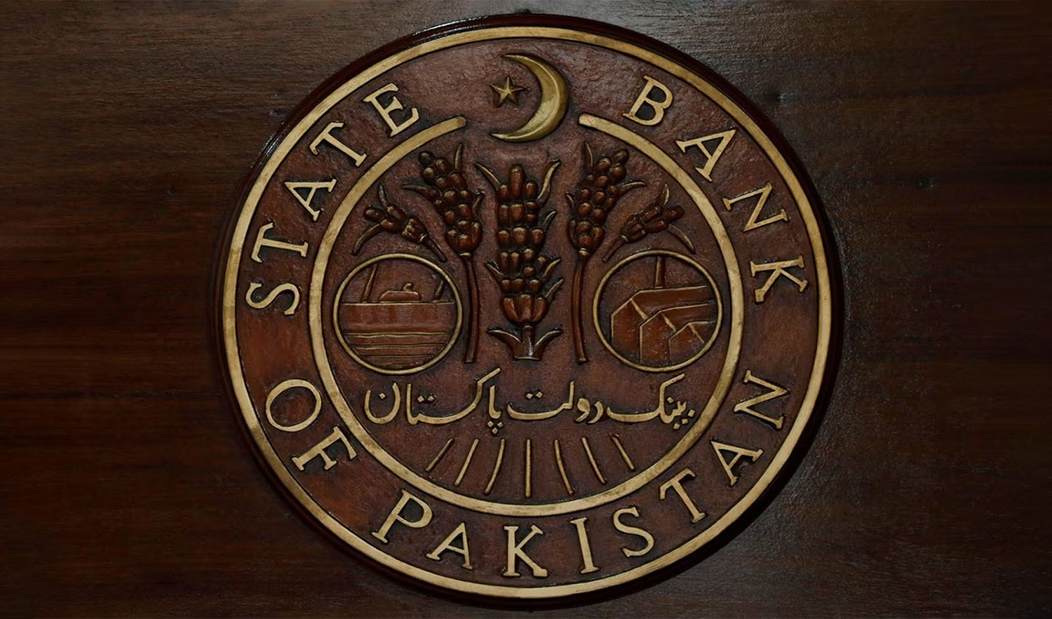 The logo of the State Bank of Pakistan is pictured on a reception desk at the head office in Karachi, Pakistan on July 16, 2019. (REUTERS/File)