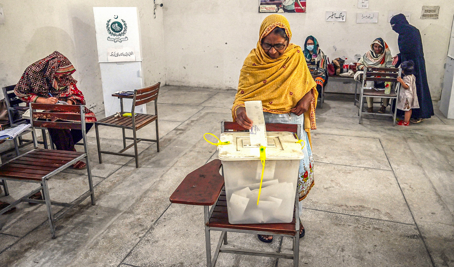 Voters cast their ballot at a polling station during the by-election in Punjab province assembly seat in Lahore, Pakistan, on July 17, 2022. (AFP/File)