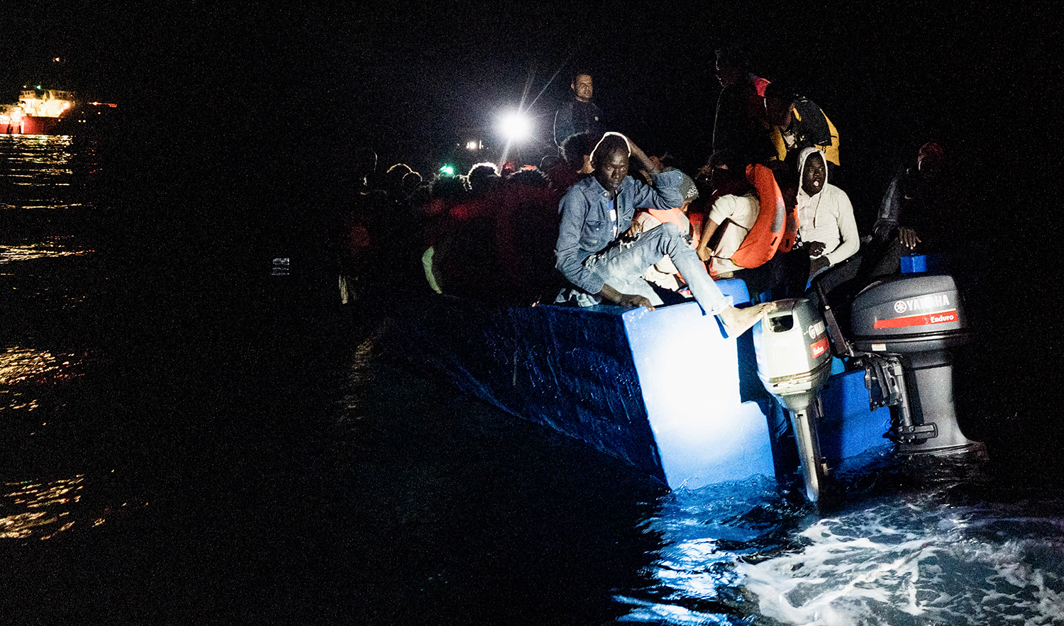 Migrants prepare to get on board the Ocean Viking ship sailing in the international waters off Malta in the Mediterranean Sea, after being rescued by European maritime-humanitarian organization "SOS Mediterranee" overnight on October 25, 2022. (AFP/File)