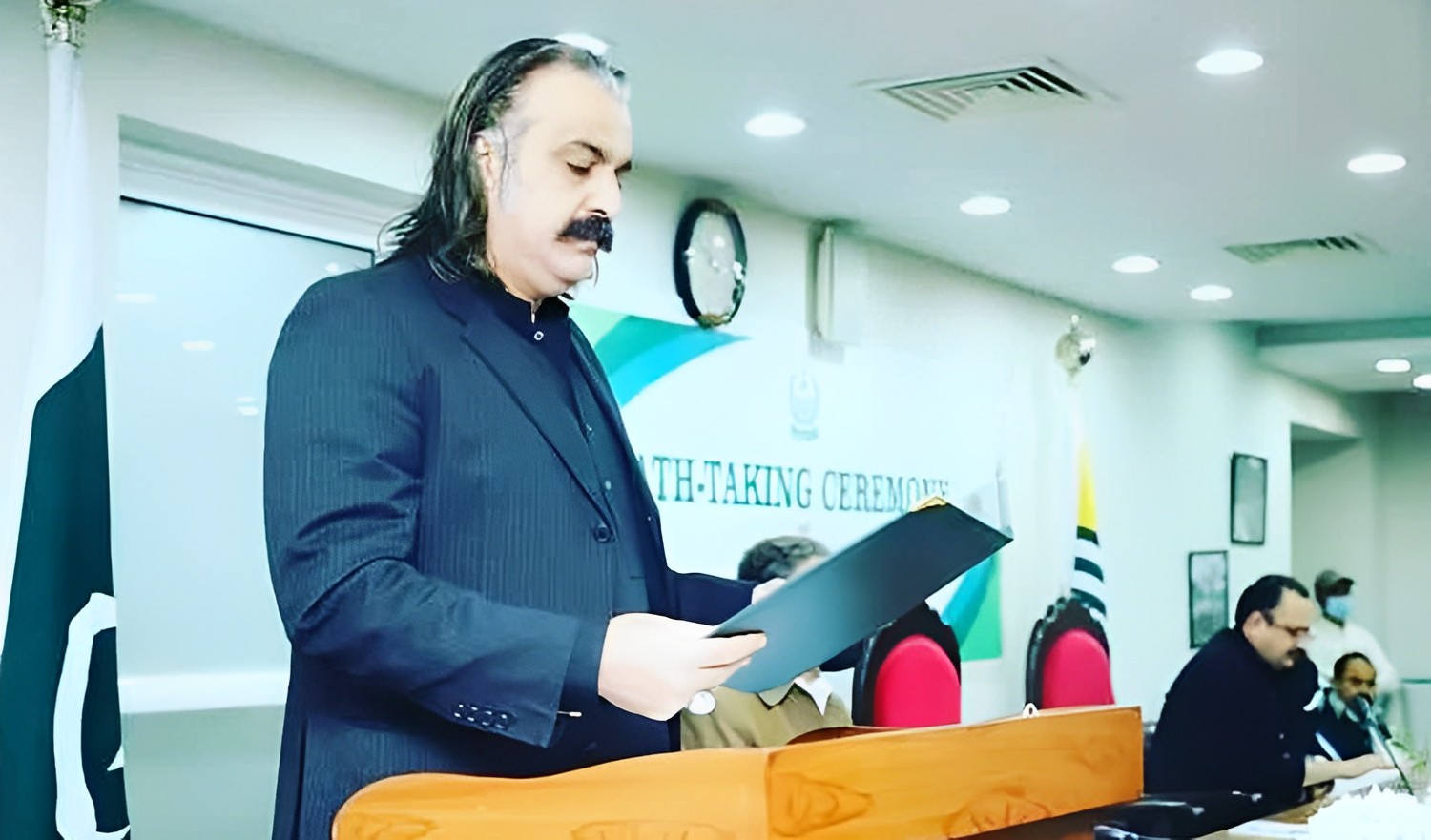 Pakistan former federal minister for Kashmir and Gilgit-Baltistan, Ali Amin Khan Gandapur, taking oath from newly elected members of Azad Jammu and Kashmir Council in Islamabad on February 22, 2022. (Photo courtesy: @aliaminkhanpti/Instagram)