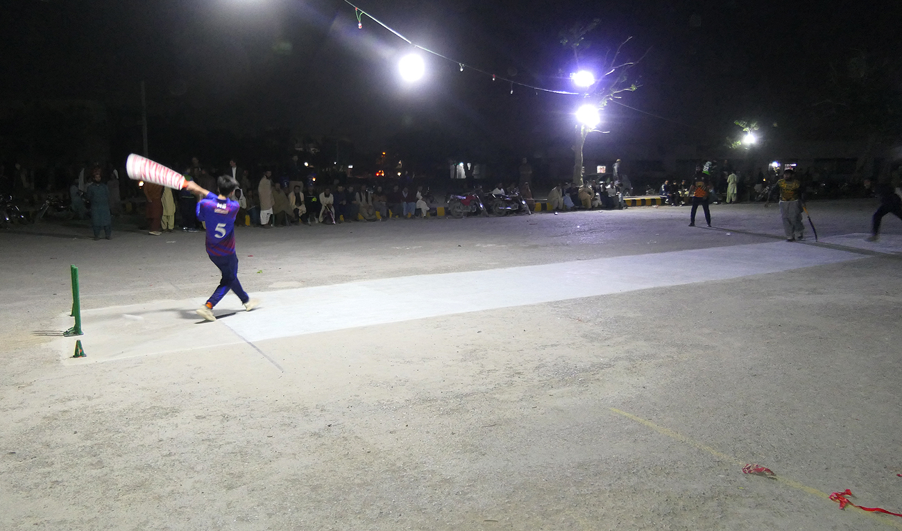 A player plays the shot during Ramadan tape ball floodlight night cricket tournament in Quetta Pakistan on April 5, 2023. (AN Photo)