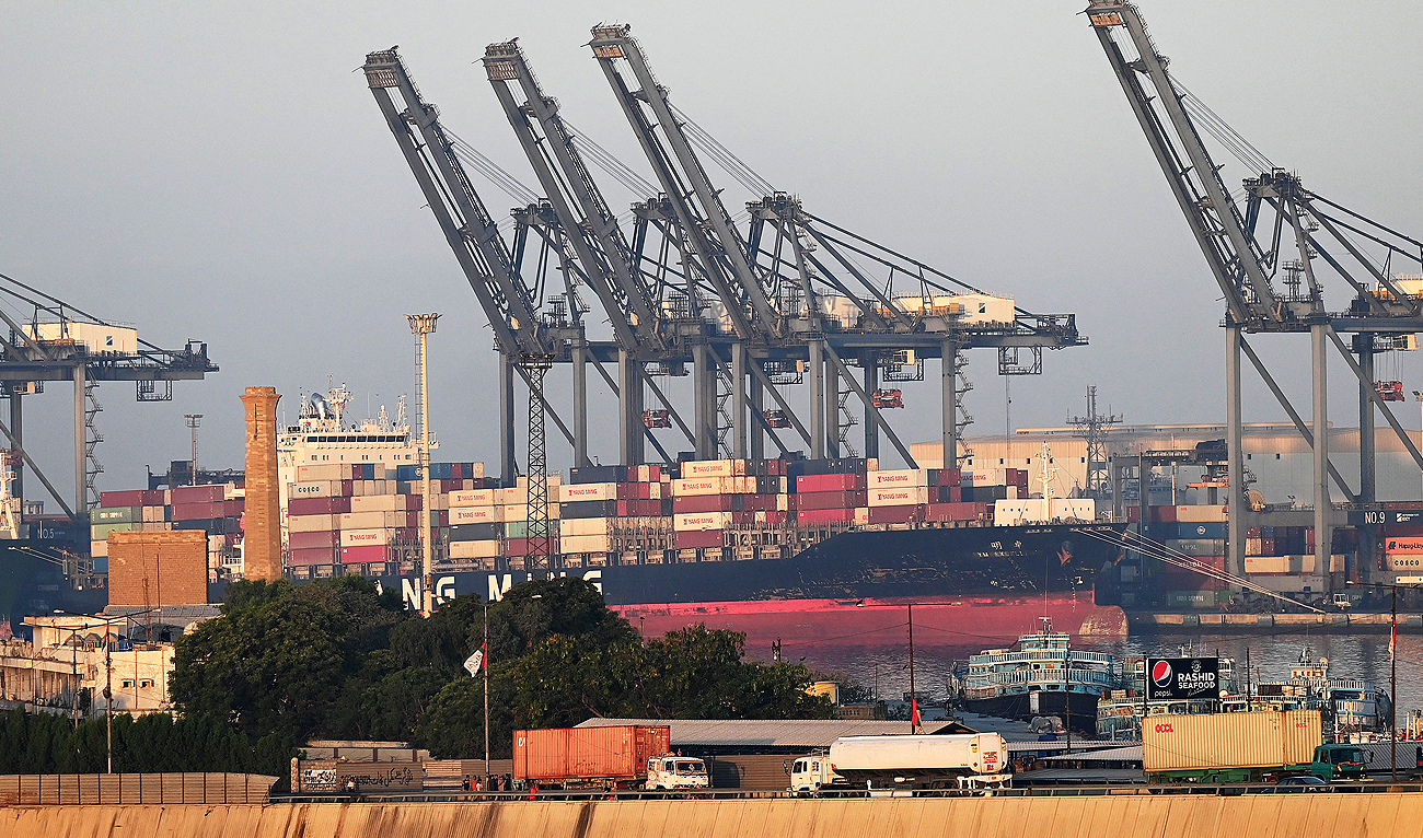 Shipping containers are seen stacked on a ship at a sea port in Karachi on April 6, 2023. (Photo courtesy: AFP)