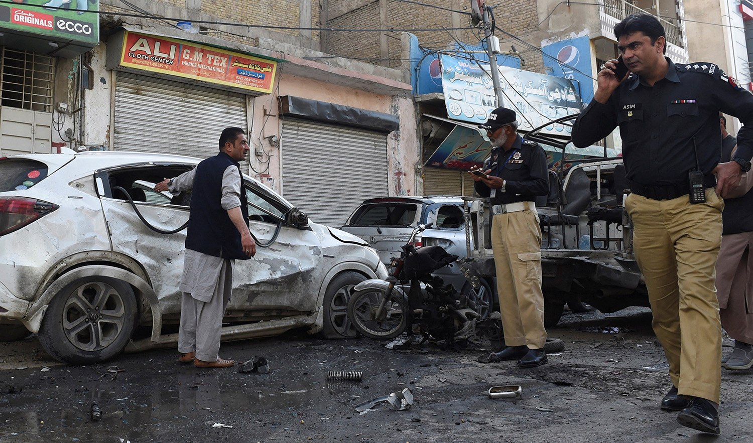 Police officers gather as they survey after a blast in Quetta, Pakistan on April 10, 2023. (REUTERS)