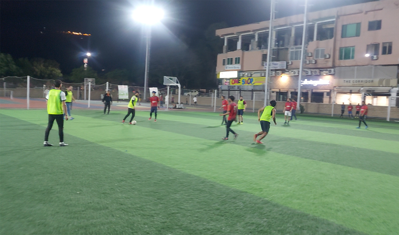 The picture taken on April 9, 2023 shows young people playing football at a multipurpose ground in Pakistan's capital Islamabad. (AN photo)