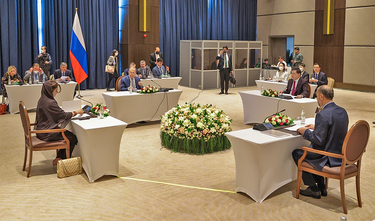 In this handout photo released by Russian Foreign Ministry Press Service, from left: Pakistani Minister of State for Foreign Affairs Hina Rabbani Khar, Russian Foreign Minister Sergey Lavrov, Chinese Foreign Minister Qin Gang and Iranian Foreign Minister Hossein Amir-Abdollahian talk during a ministerial meeting in Samarkand, Uzbekistan, on April 13, 2023. (Russian Foreign Ministry Press Service via AP)