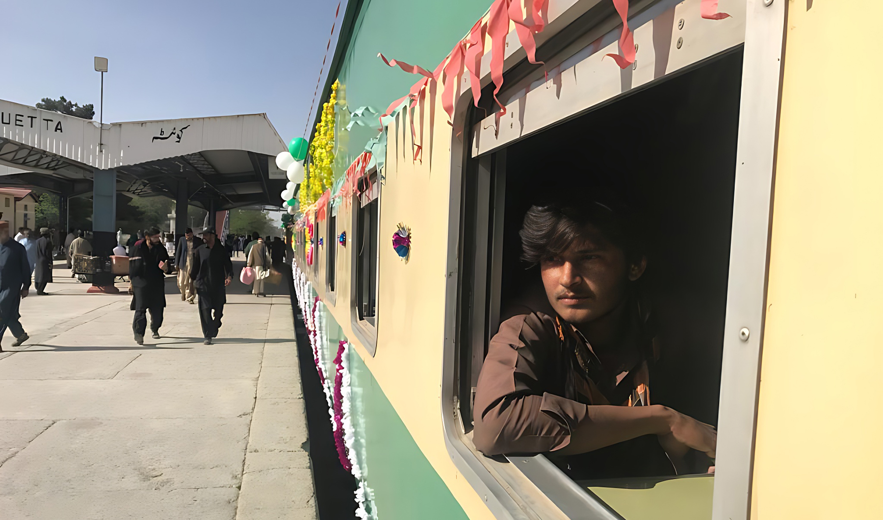 Nadim Ahmed, a passenger traveling to Punjab, looks out through a window of Jaffer Express standing at a railway station in Quetta, Pakistan, on April,15 2023. (AN photo)