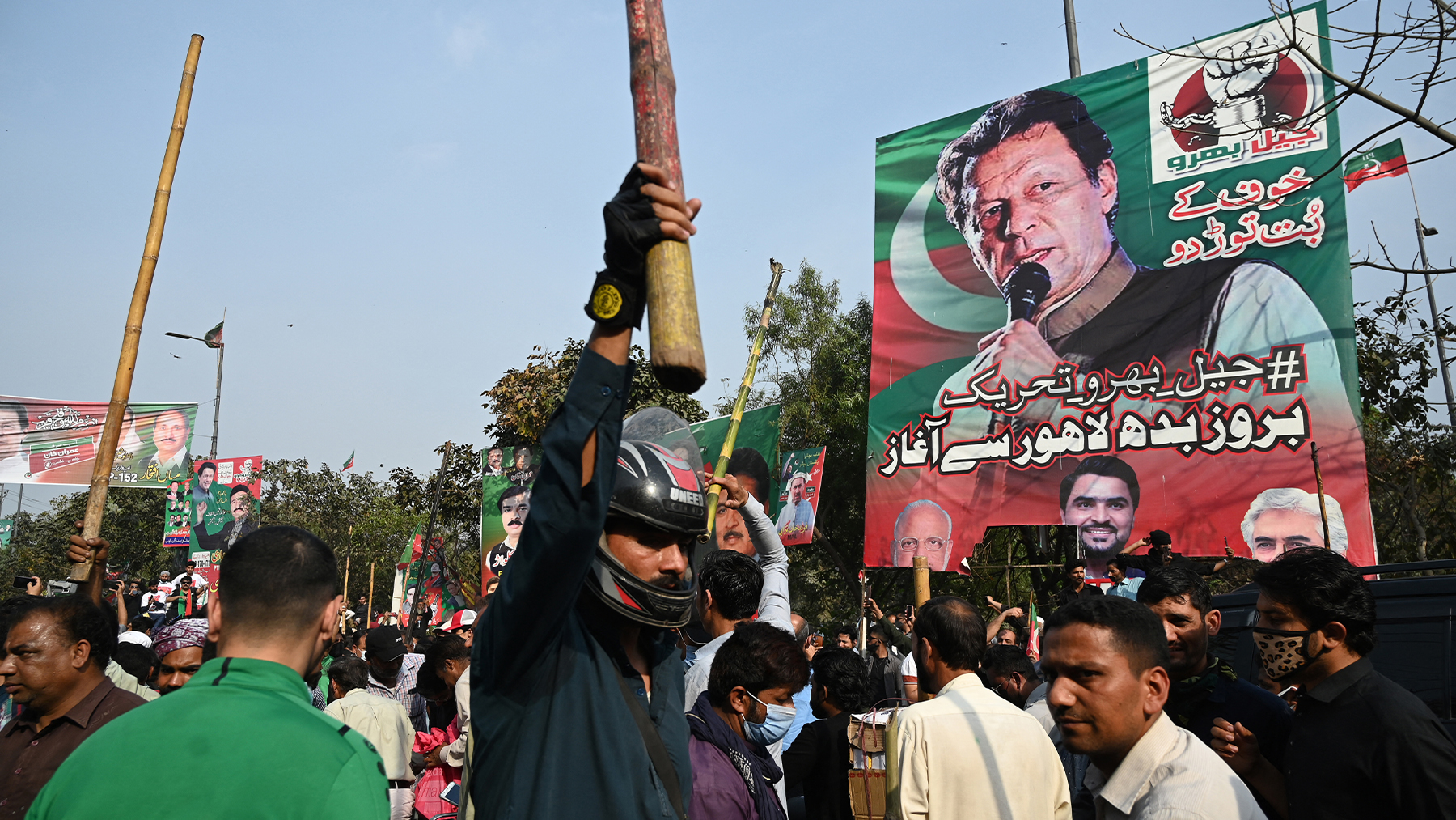 Supporters of former Pakistan's prime minister Imran Khan block a road near Khan's residence to prevent officers from arresting him, in Lahore, Pakistan, on March 15, 2023. (AFP/File)