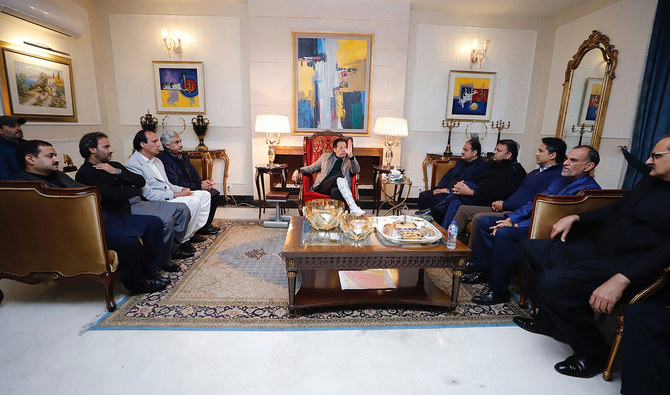 In this picture, shared by Pakistan Tehreek-e-Insaf party on January 15, 2023, former Pakistan prime minister Imran Khan (center) chairs a party meeting at his residence in Lahore. (Photo courtesy: Facebook/ImranKhanOfficial)