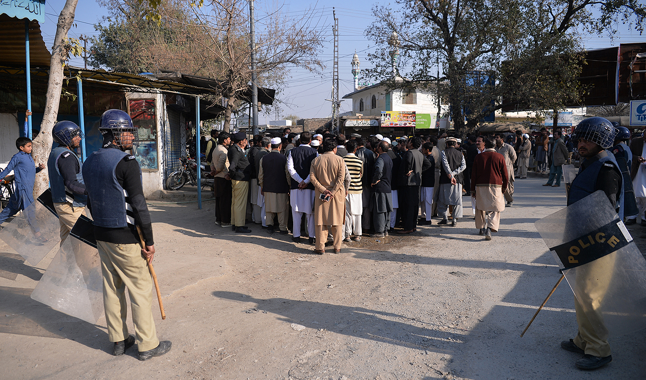In this file photo, taken on February 7, 2018, Pakistani police guard a street in Haripur district. (Photo courtesy: AFP/File)