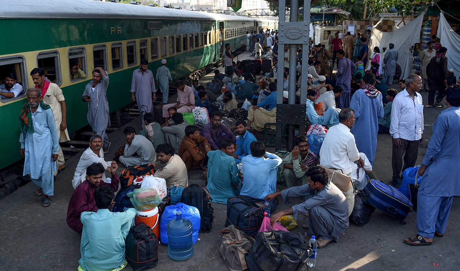 Pakistani people wait for the train to travel back home to be with their families ahead of the Muslim festival of Eid Al-Fitr, in Karachi on June 2, 2019. (AFP/File)