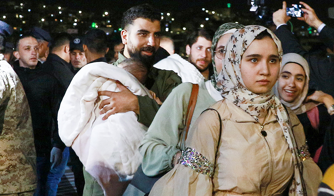 People evacuated from Sudan arrive at a military airport in Amman on April 24, 2023. (Photo courtesy: AFP)