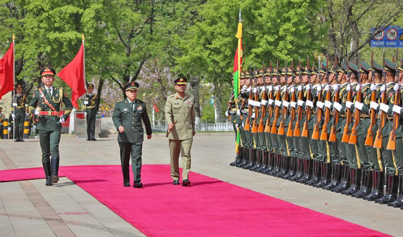 The picture shared by Pakistan Army on April 26, 2023, shows Pakistan Army Chief General Asim Munir (center right) receiving guard of honor as he visits People's Liberation Army headquarters during this four-day visit to China. (Photo courtesy: ISPR)