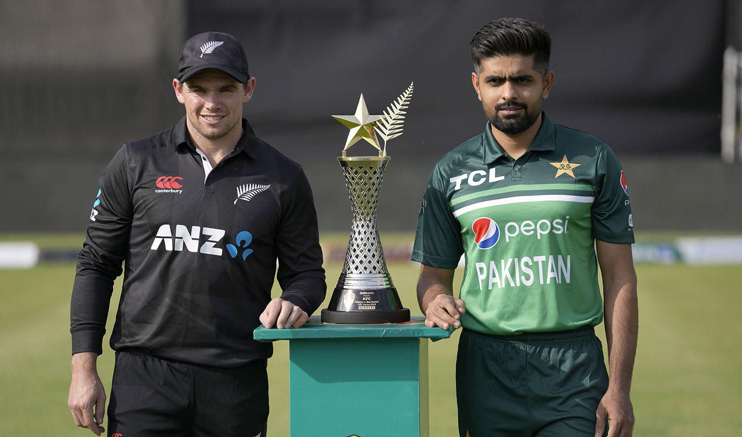 New Zealand's skipper Tom Latham, left, and his Pakistani counterpart Babar Azam pose for photo with the trophy of one-day international cricket matches series, in Rawalpindi, Pakistan, on April 26, 2023. (AP)