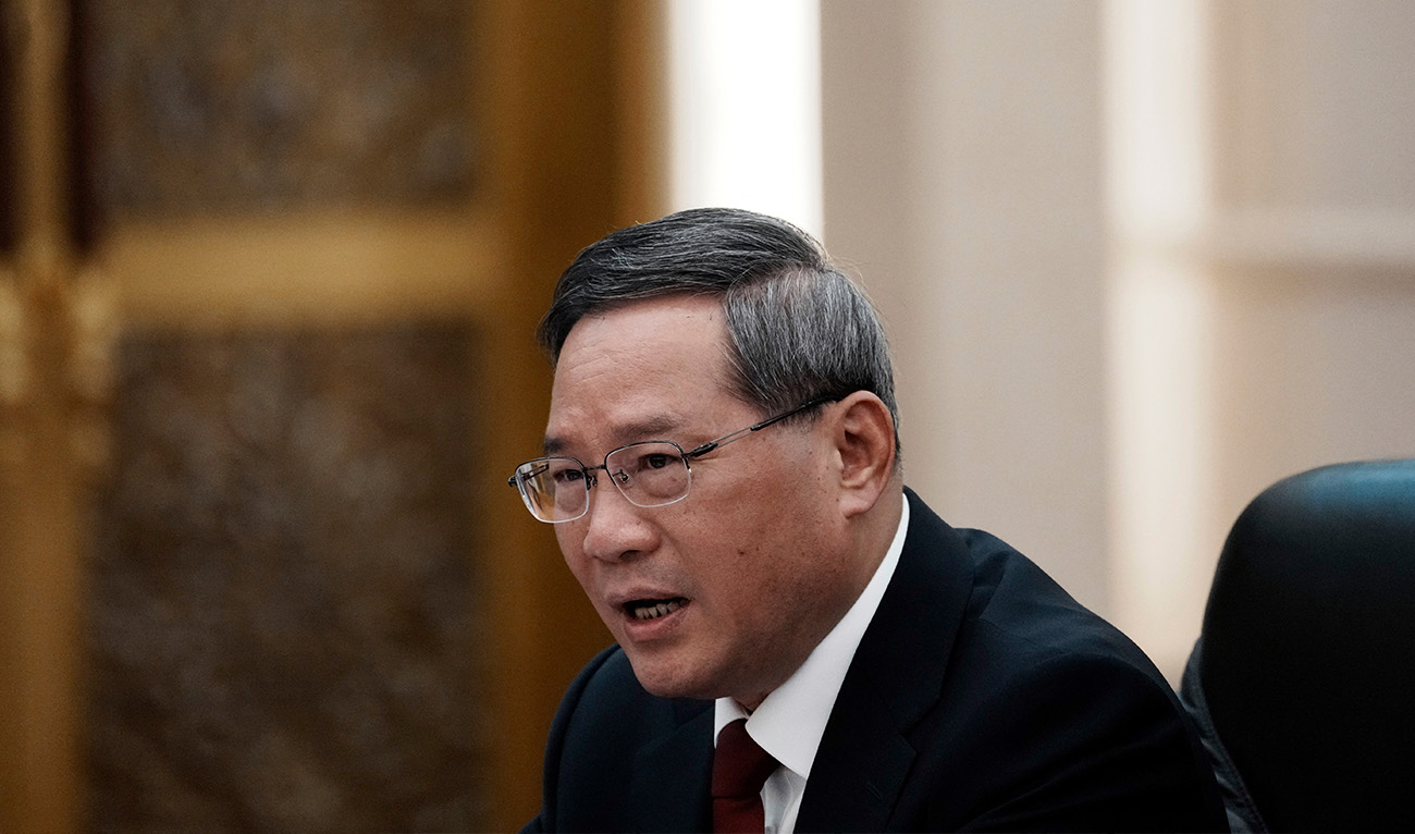 Chinese Premier Li Qiang attends a meeting with French President Emmanuel Macron at the Great Hall of the People in Beijing on April 6, 2023. (AFP/File)