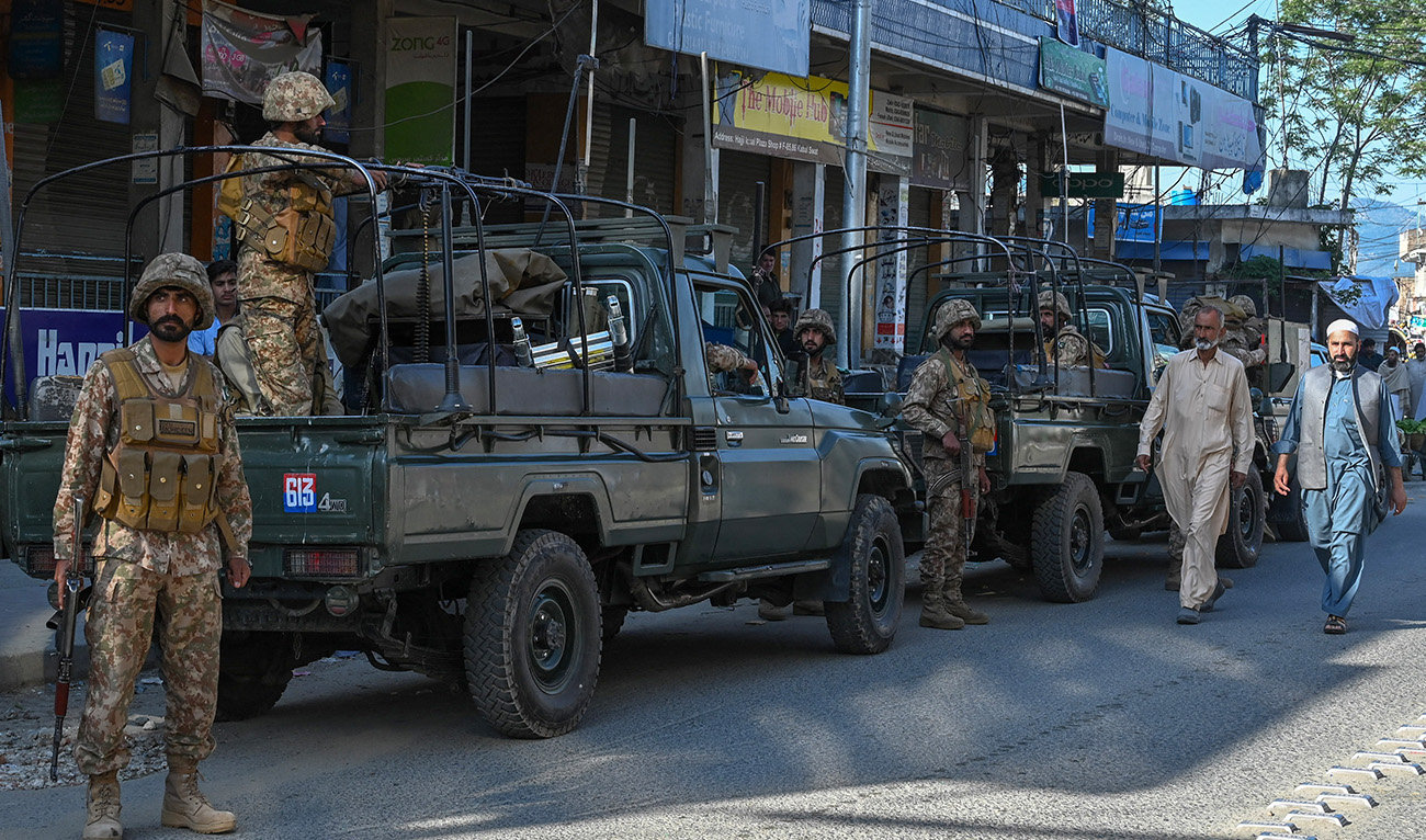Army troops stand stand guard along a street in Kabal town of Swat Valley in Pakistan’s northwestern region of Khyber Pakhtunkhwa province on April 25, 2023. (AFP/File)