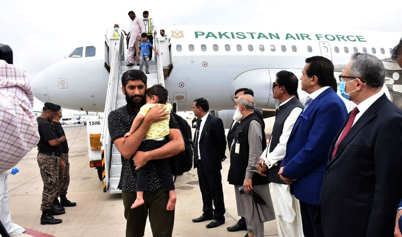 This picture shows the first group of Pakistani nationals evacuated from strife-torn Sudan arriving at Jinnah International Airport in Karachi on April 28, 2023. (Photo courtesy: Press Information Department)