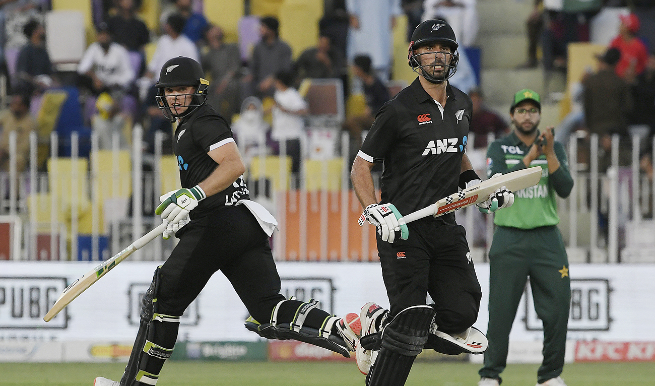New Zealand's captain Tom Latham (L) and Daryl Mitchell run between the wickets during the first one-day international (ODI) cricket match between Pakistan and New Zealand at the Rawalpindi Cricket Stadium in Rawalpindi on April 27, 2023. (Photo courtesy: AFP)