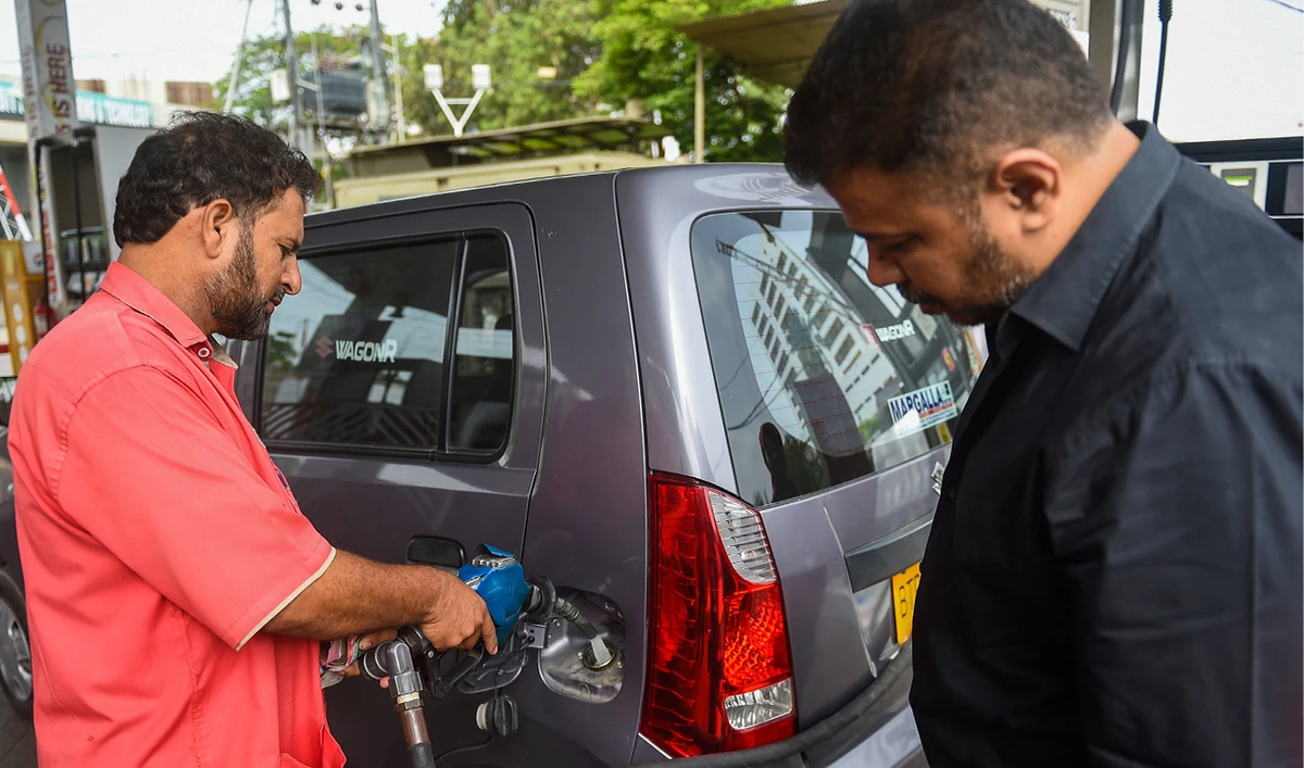 An employee fills a car at a service station in Karachi, Pakistan, on May 27, 2022. (AFP/File)