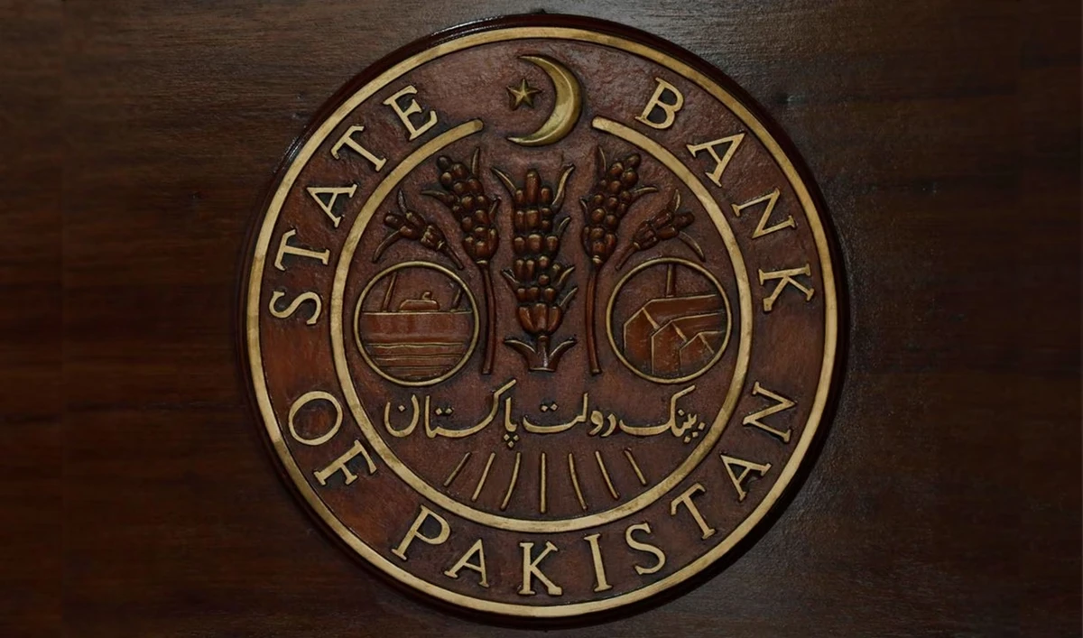 A logo of the State Bank of Pakistan (SBP) is pictured on a reception desk at the head office in Karachi, Pakistan on July 16, 2019. (REUTERS/File Photo)