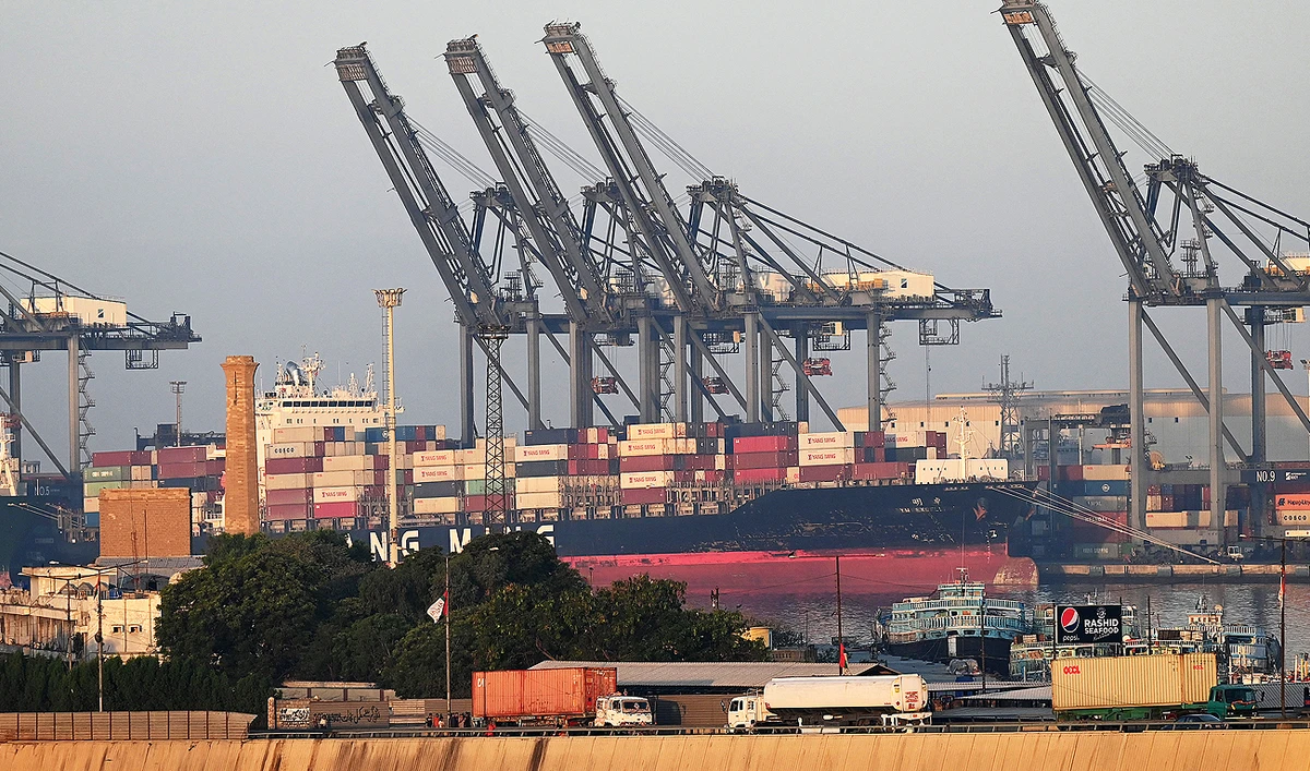Shipping containers are seen stacked on a ship at a sea port in Karachi on April 6, 2023. (Photo courtesy: AFP)