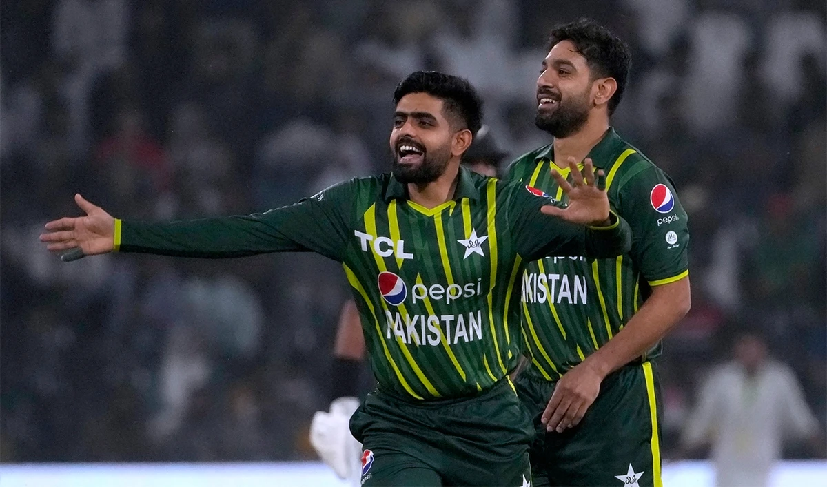 Pakistan's Babar Azam, center, Haris Rauf celebrate after the dismissal of New Zealand's James Neesham during the first twenty20 cricket match between Pakistan and New Zealand, in Lahore, Pakistan, on April 15, 2023. (AP)