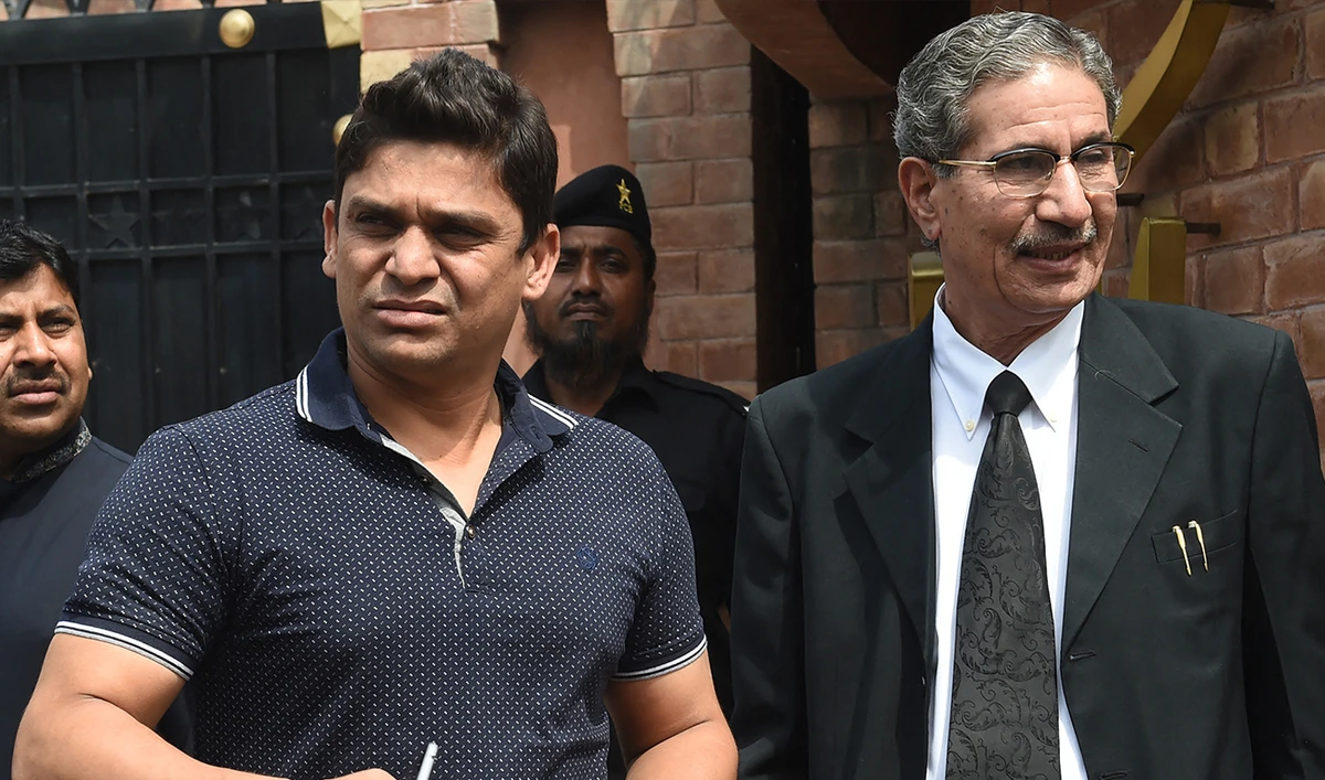 Suspended Pakistani cricketer Khalid Latif (L) leaves with his lawyer after appearing before a tribunal in Lahore on March 31, 2017. (AFP/File)