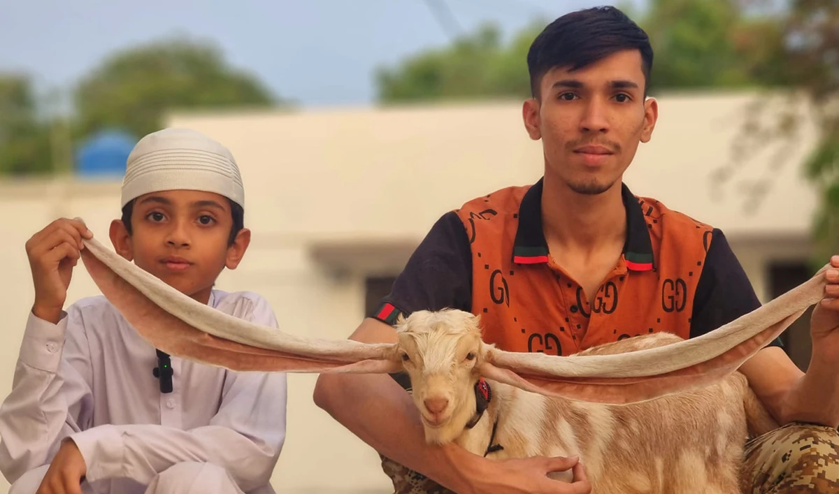 The undated photo shows Yasir Ali Narejo (Left) and a family member posing with Simbi in Karachi, Pakistan. (AN Photo)