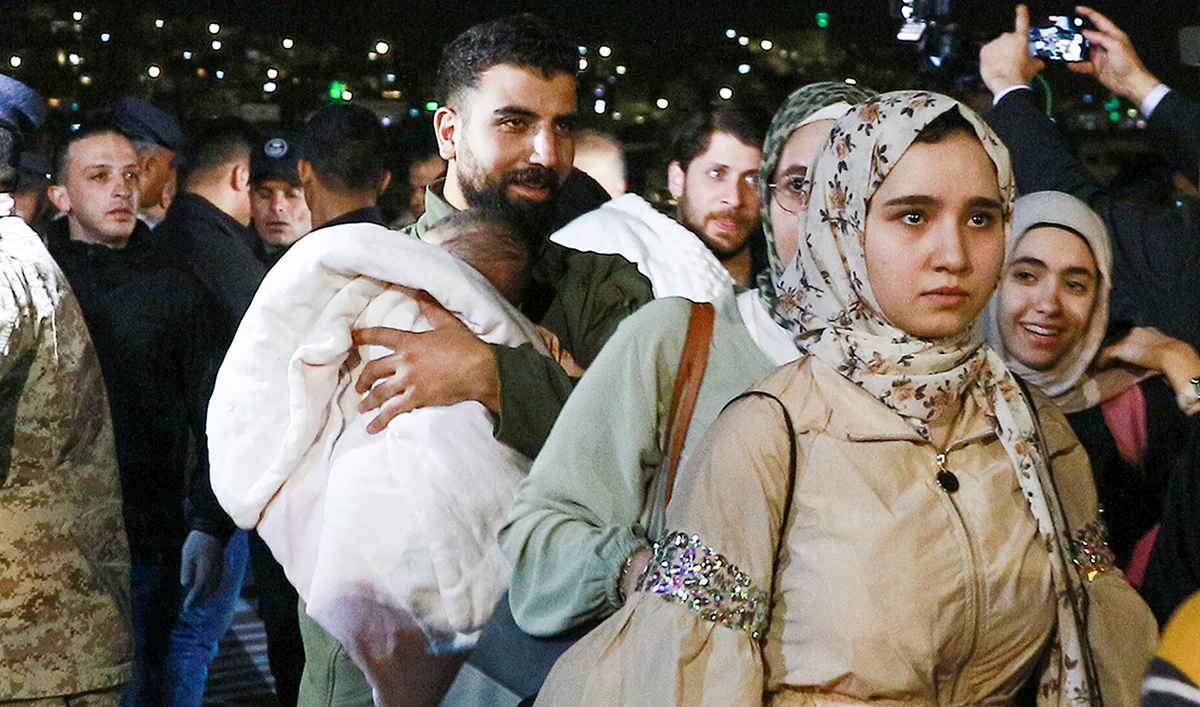 People evacuated from Sudan arrive at a military airport in Amman on April 24, 2023. (Photo courtesy: AFP)