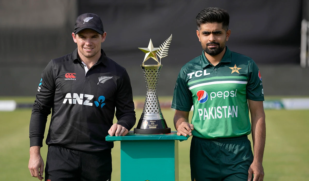 New Zealand's skipper Tom Latham, left, and his Pakistani counterpart Babar Azam pose for photo with the trophy of one-day international cricket matches series, in Rawalpindi, Pakistan, on April 26, 2023. (AP)
