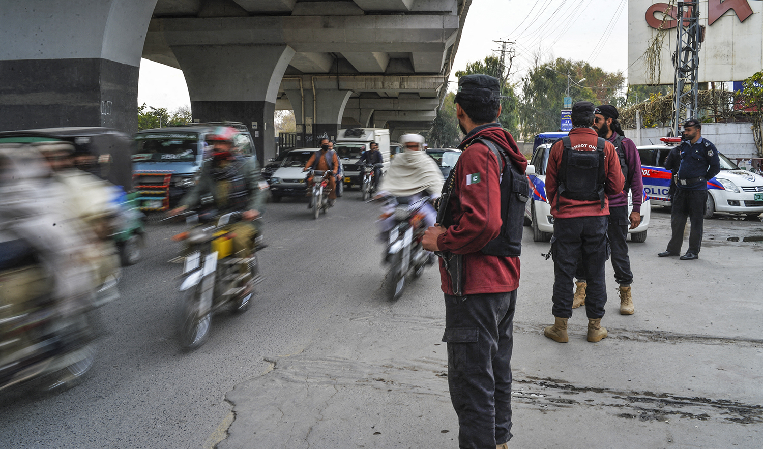 Policemen stand guard along a street a day after a mosque suicide blast inside a police headquarters in Peshawar, Pakistan on February 1, 2023. (AFP/File)