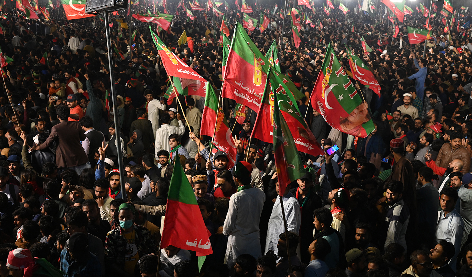 Supporters of Pakistan's former prime minister Imran Khan gather at a rally in Lahore late on March 25, 2023. (AFP/File)